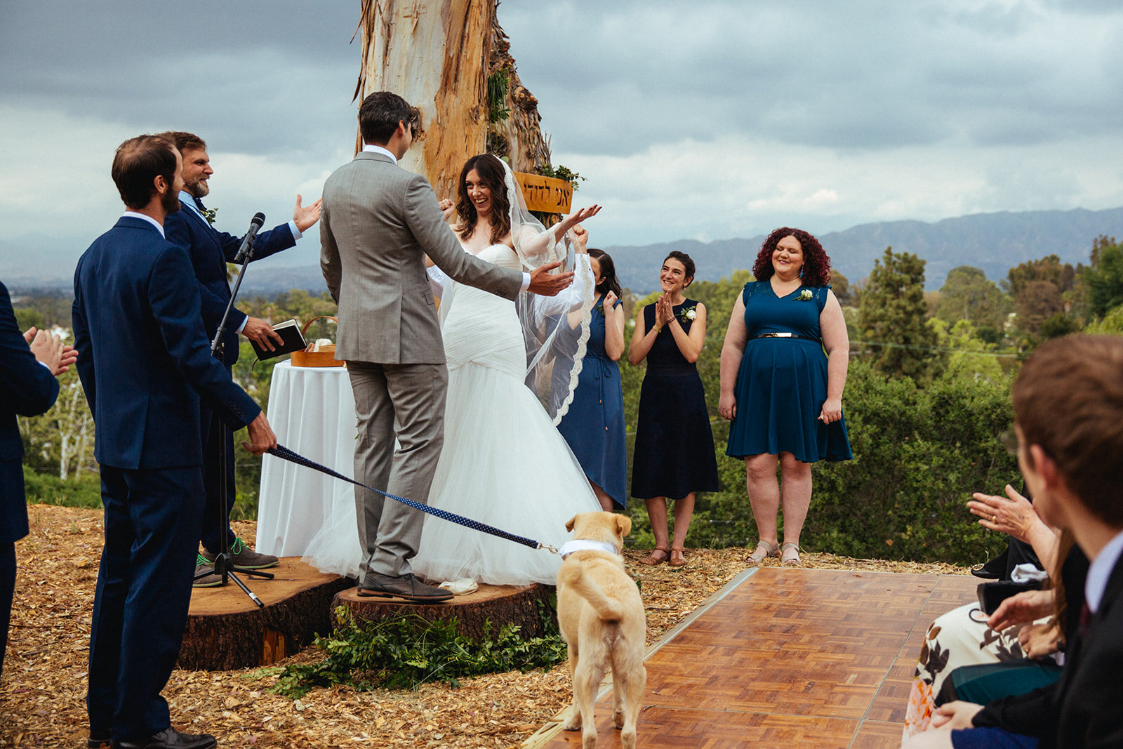Newlyweds during ceremony with wedding party and dog in LA Shawnee Custalow Queer Wedding Photography
