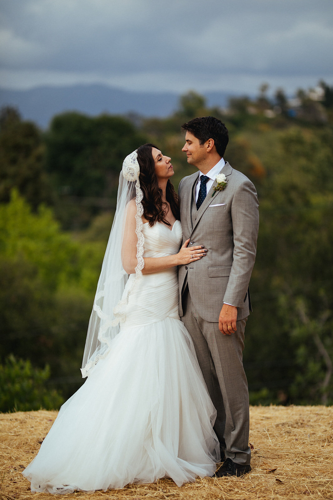Newlyweds looking at each other in Los Angeles CA Shawnee Custalow Queer Wedding Photography