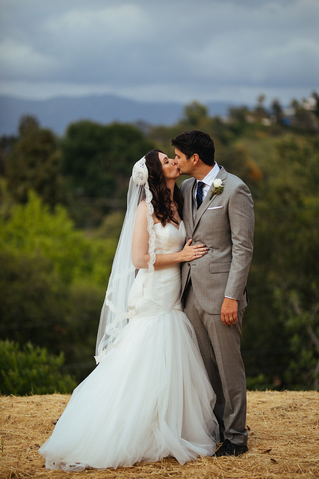 Newlyweds kiss outside in LA California Shawnee Custalow Queer Wedding Photography