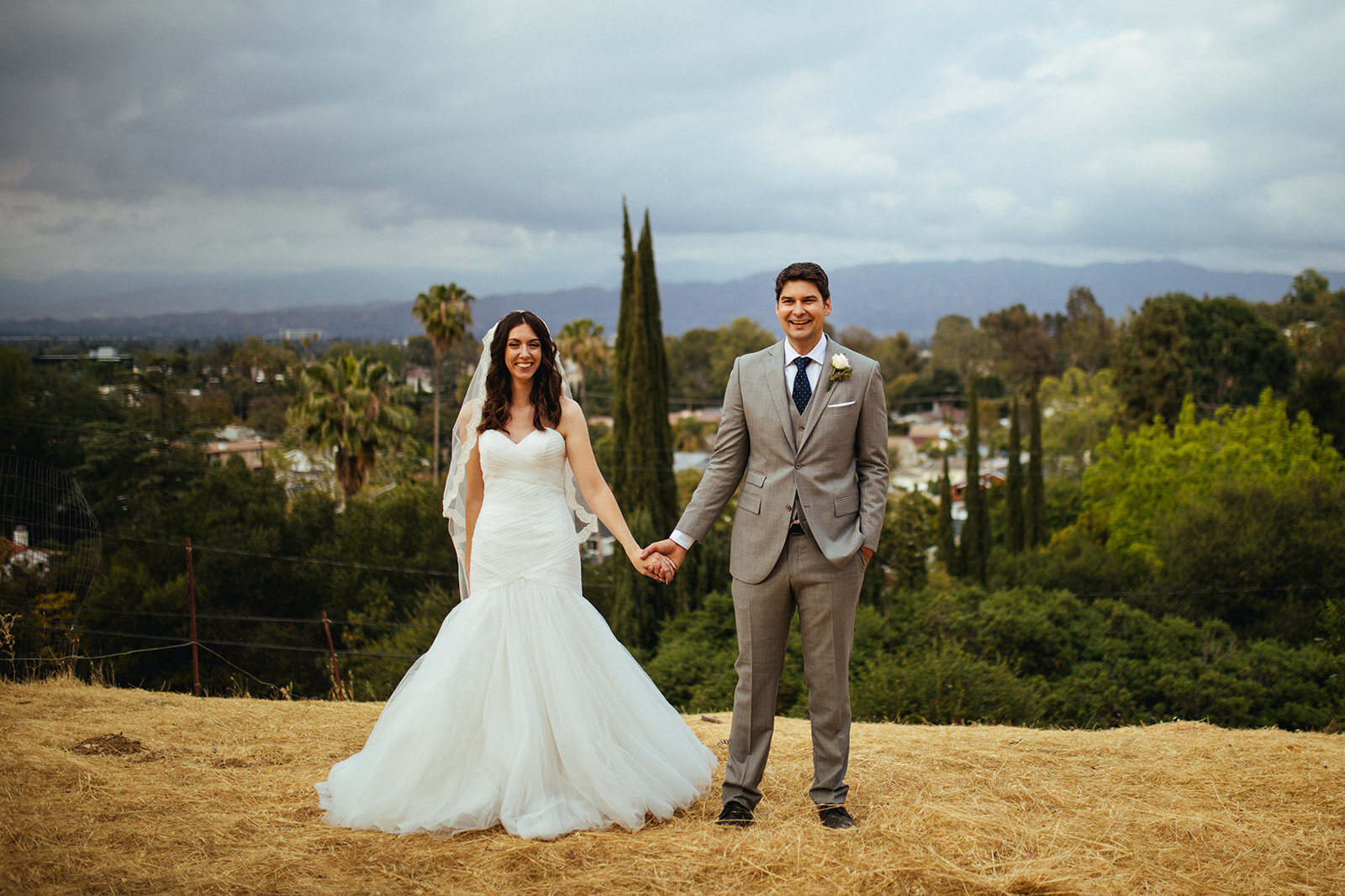 Newlywed couple posing holding hands in LA Shawnee Custalow Queer Wedding Photography
