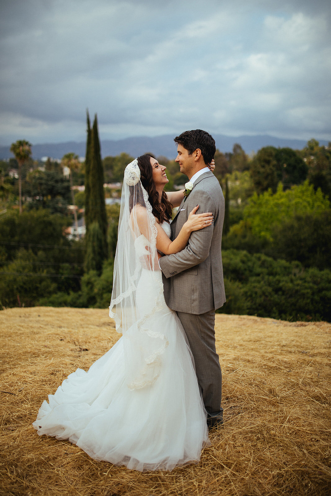 Bride and groom embracing after ceremony in LAShawnee Custalow Queer Wedding Photography