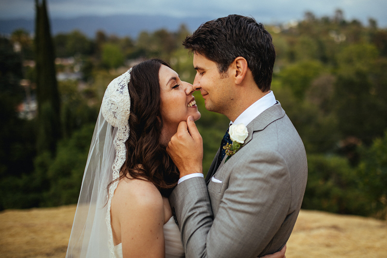 Newlyweds lean in for a kiss in Los Angeles Shawnee Custalow Queer Wedding Photography