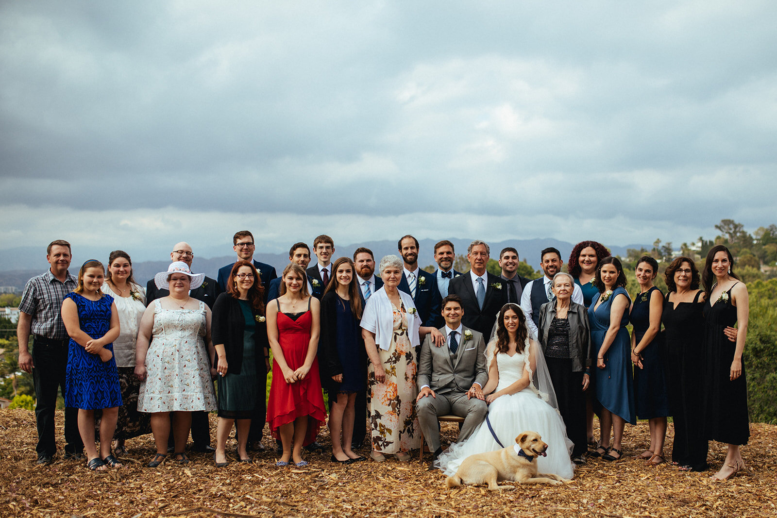 Newlyweds posing with extended family and wedding party in LA Shawnee Custalow Queer Wedding Photography