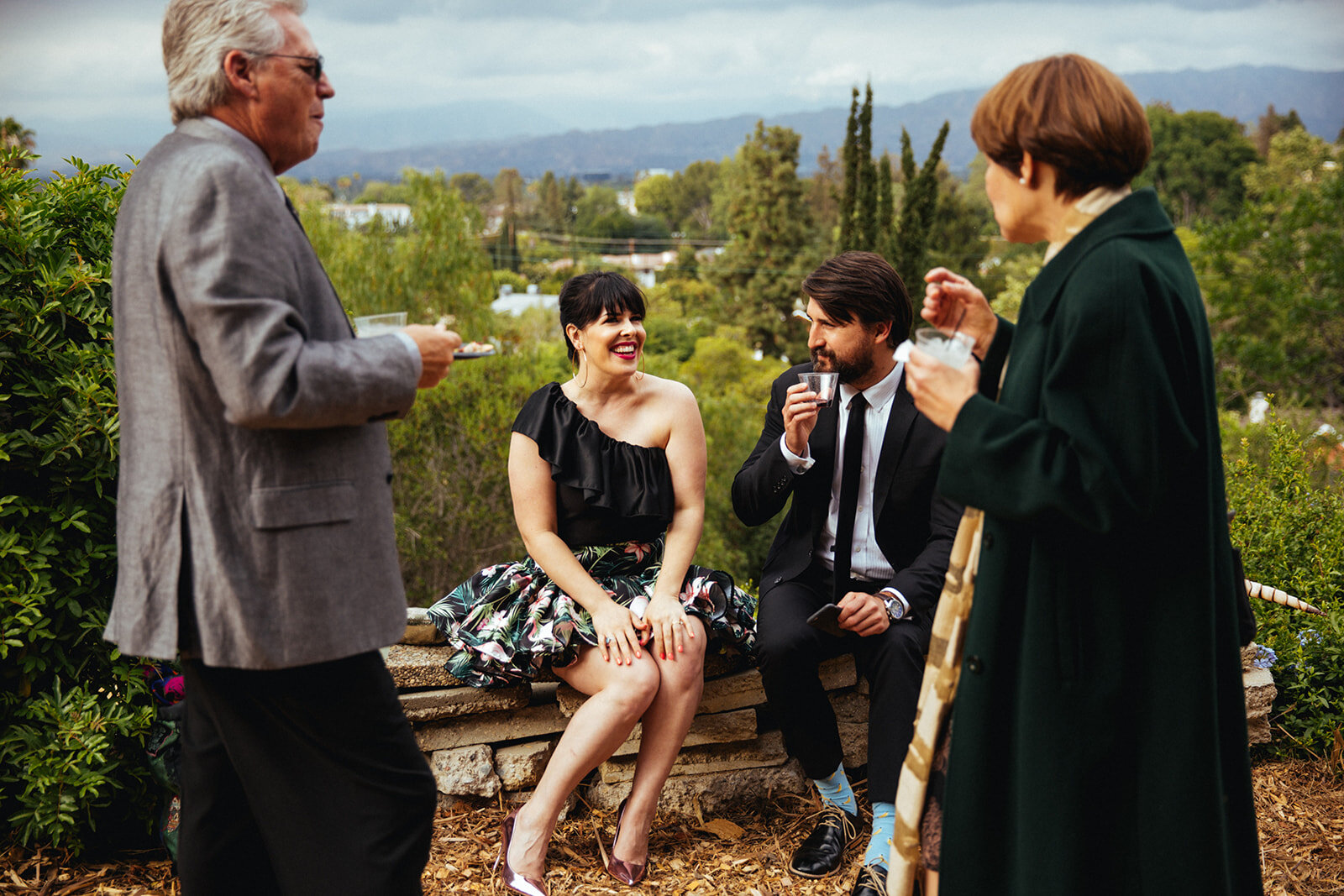 Wedding guests mingling at reception in Studio City LA Shawnee Custalow Queer Wedding Photography