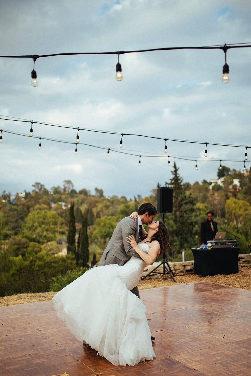 Newly married couple kissing after their first dance in LA Shawnee Custalow Queer Wedding Photography