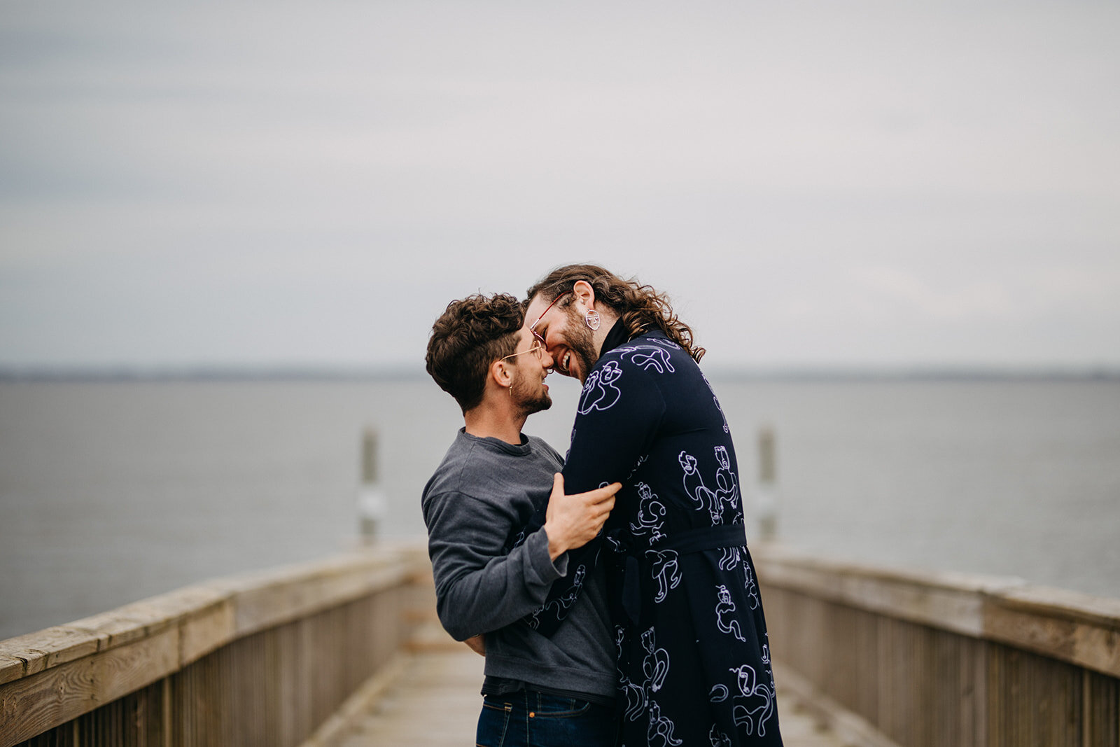 Couple leans in for a kiss at VA Beach Shawnee Custalow photography
