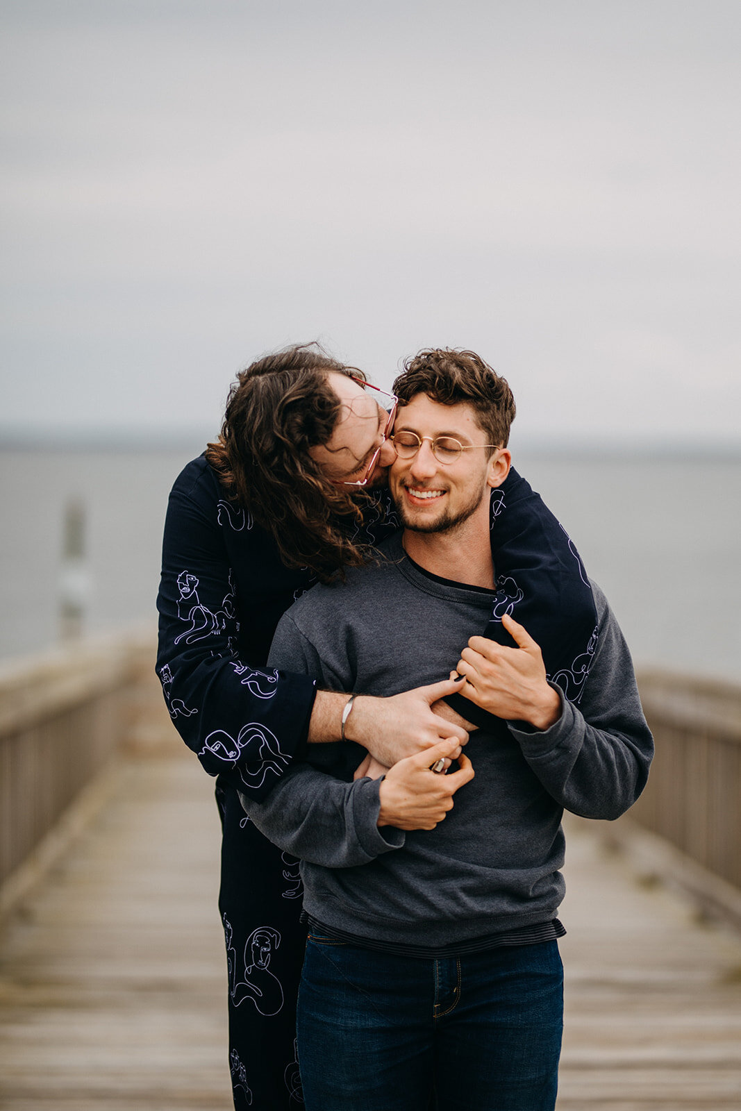 Happy couple embraces in Virginia Beach Shawnee Custalow photography