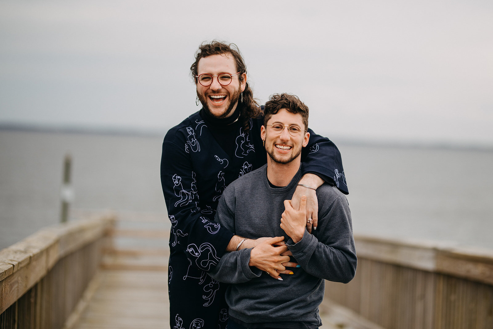 LGBTQ couple embracing at VA beach Shawnee Custalow photography