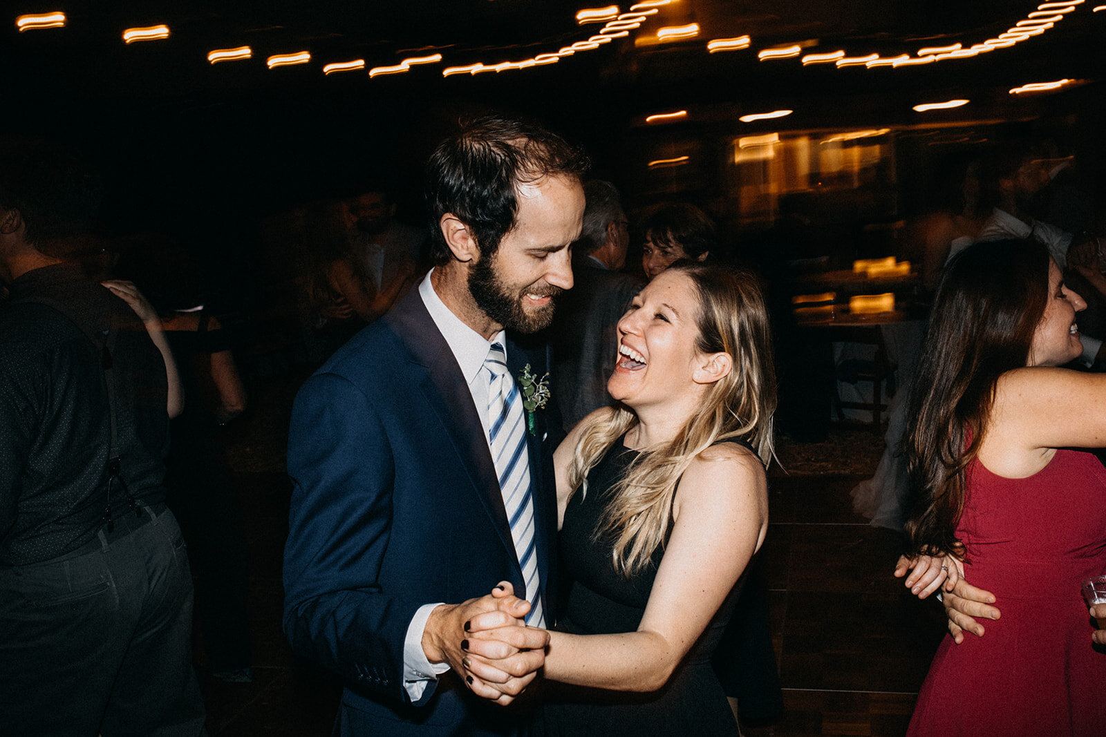 Wedding guests dancing at outdoor reception in LA Shawnee Custalow Queer Wedding Photography