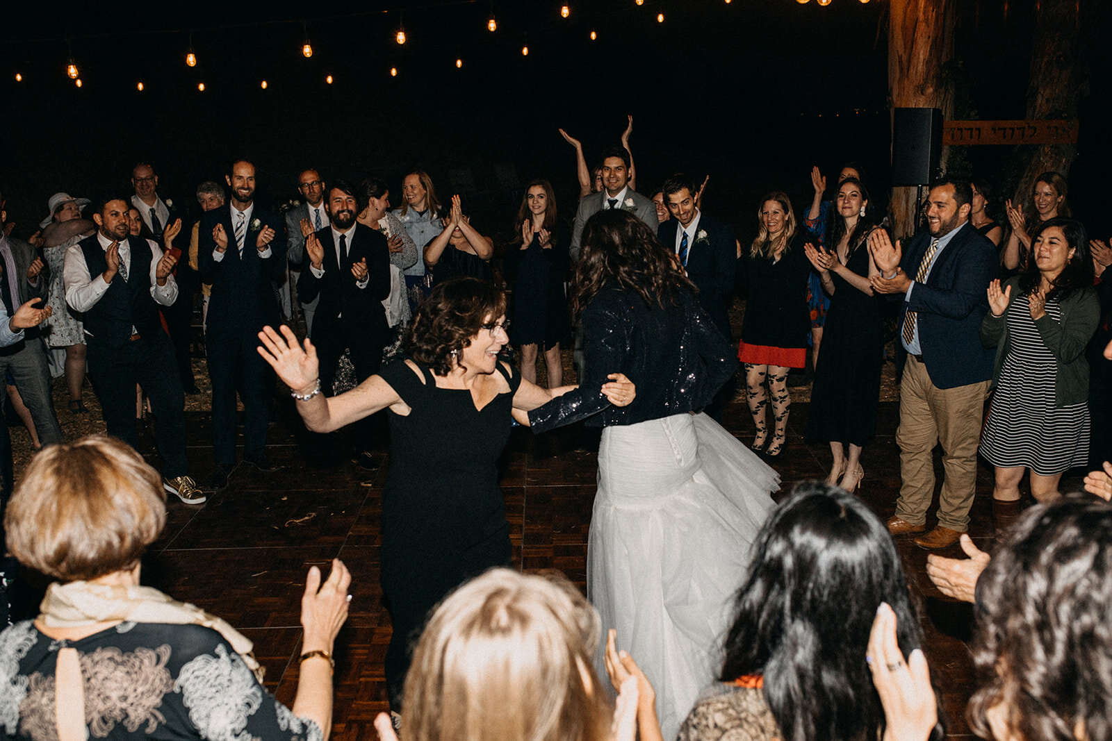 Bride dancing with mother at reception in Los Angeles Shawnee Custalow Queer Wedding Photography