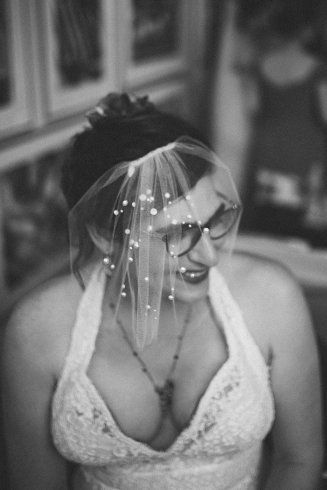 Black and white portrait of veiled bride at Torpedo Factory Alexandria VA Shawnee Custalow Queer Wedding Photography