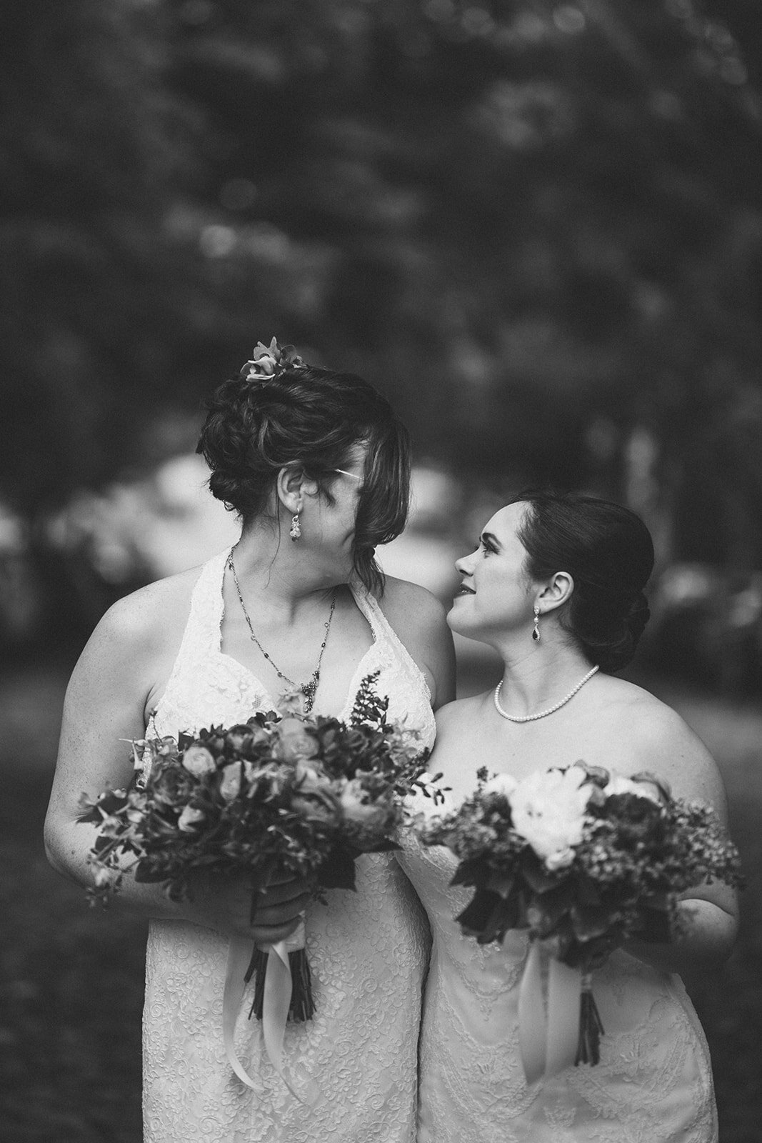 Newly married lgbtq couple embracing in Alexandria VA Shawnee Custalow Wedding Photographer