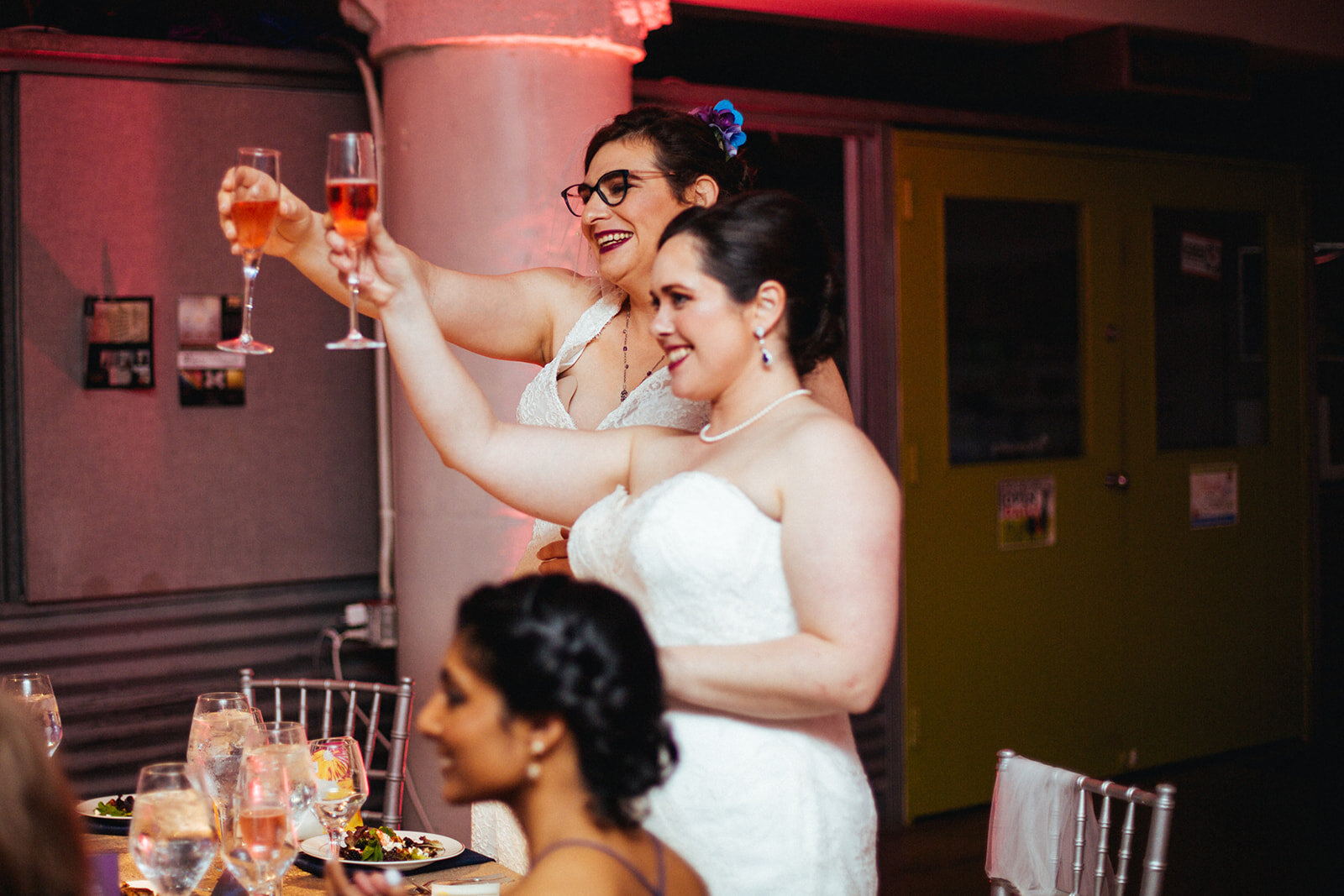 Newlywed LGBTQ couple raising a toast at Torpedo Factory Alexandria VA Shawnee Custalow