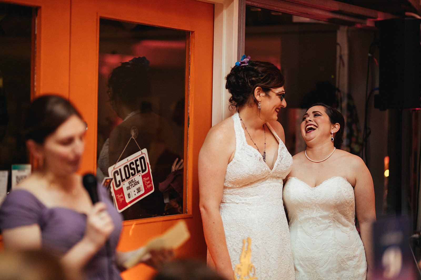 Newlywed LGBTQ couple smiling at Torpedo Factory Alexandria VA Shawnee Custalow Photography