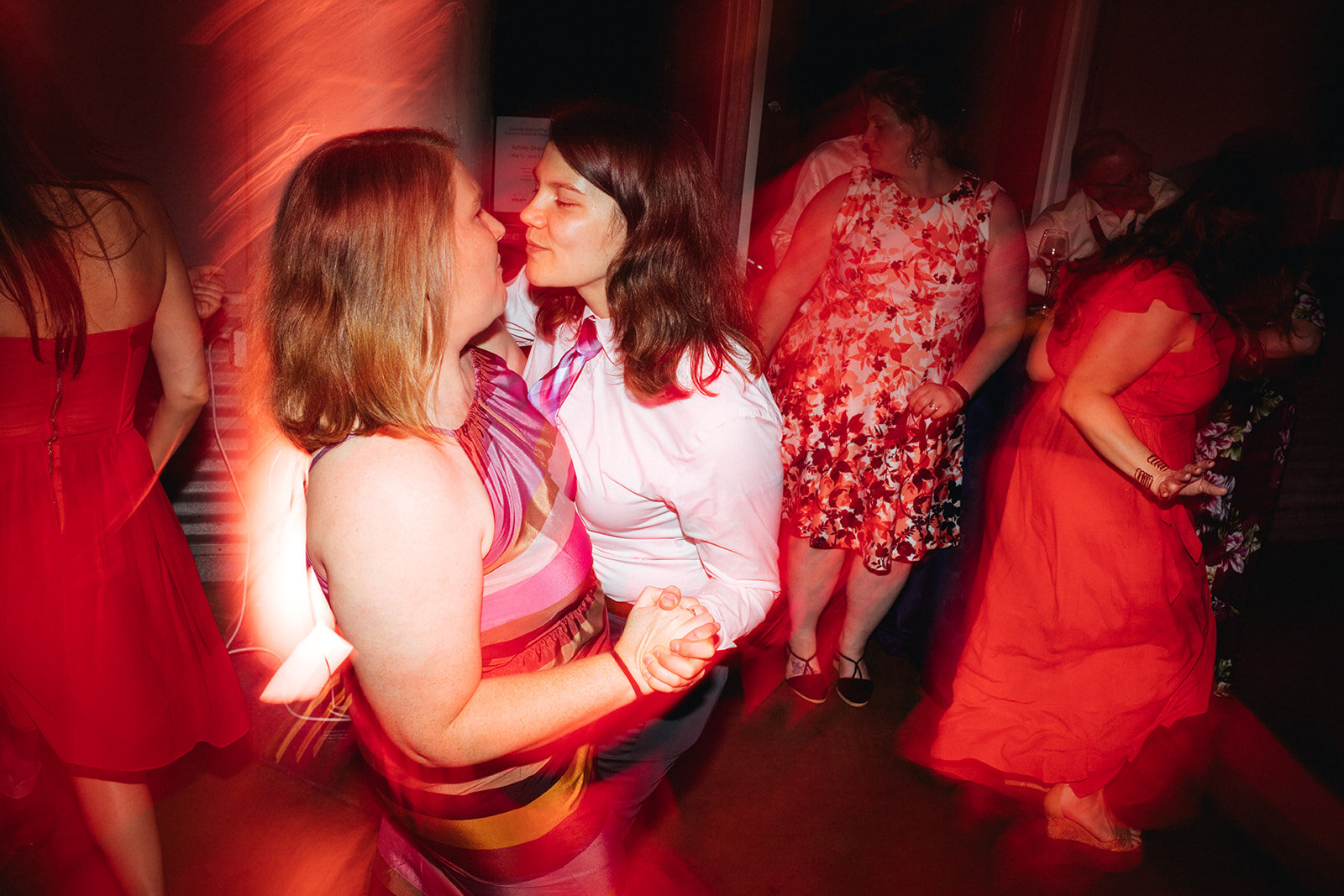 Wedding guests dancing at Torpedo Factory reception Alexandria VA Shawnee Custalow Queer Wedding Photography