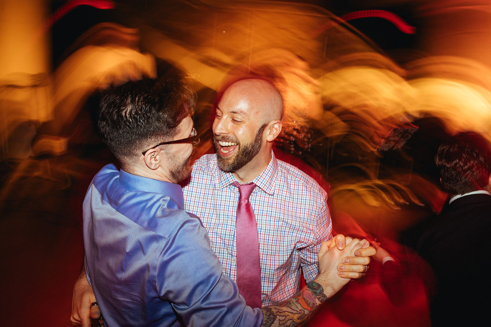 Wedding guests dancing at Torpedo Factory reception Alexandria VA Shawnee Custalow Queer Wedding Photography