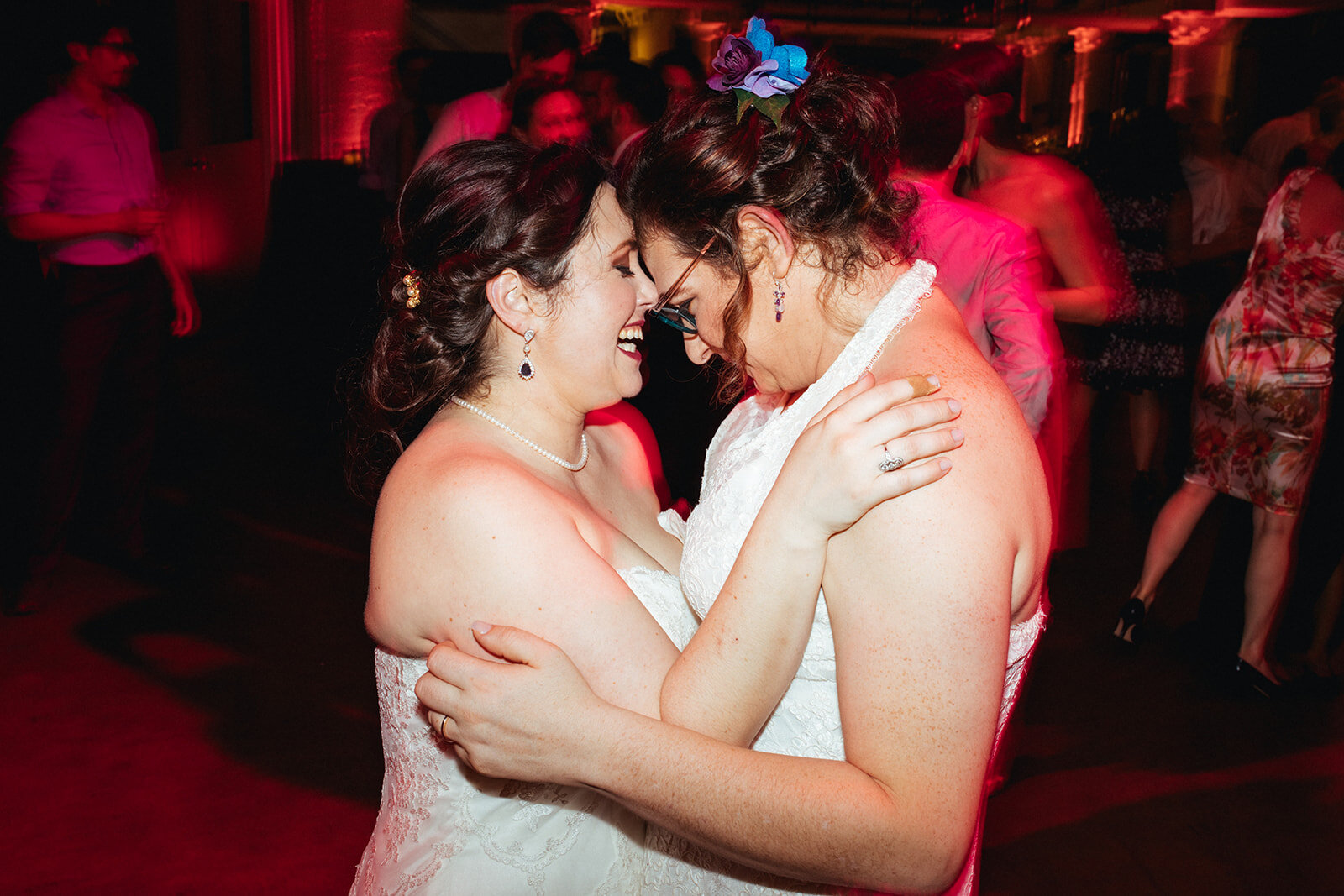 Newlyweds intimately dancing at Torpedo Factory reception Alexandria VA Shawnee Custalow Queer Wedding Photography