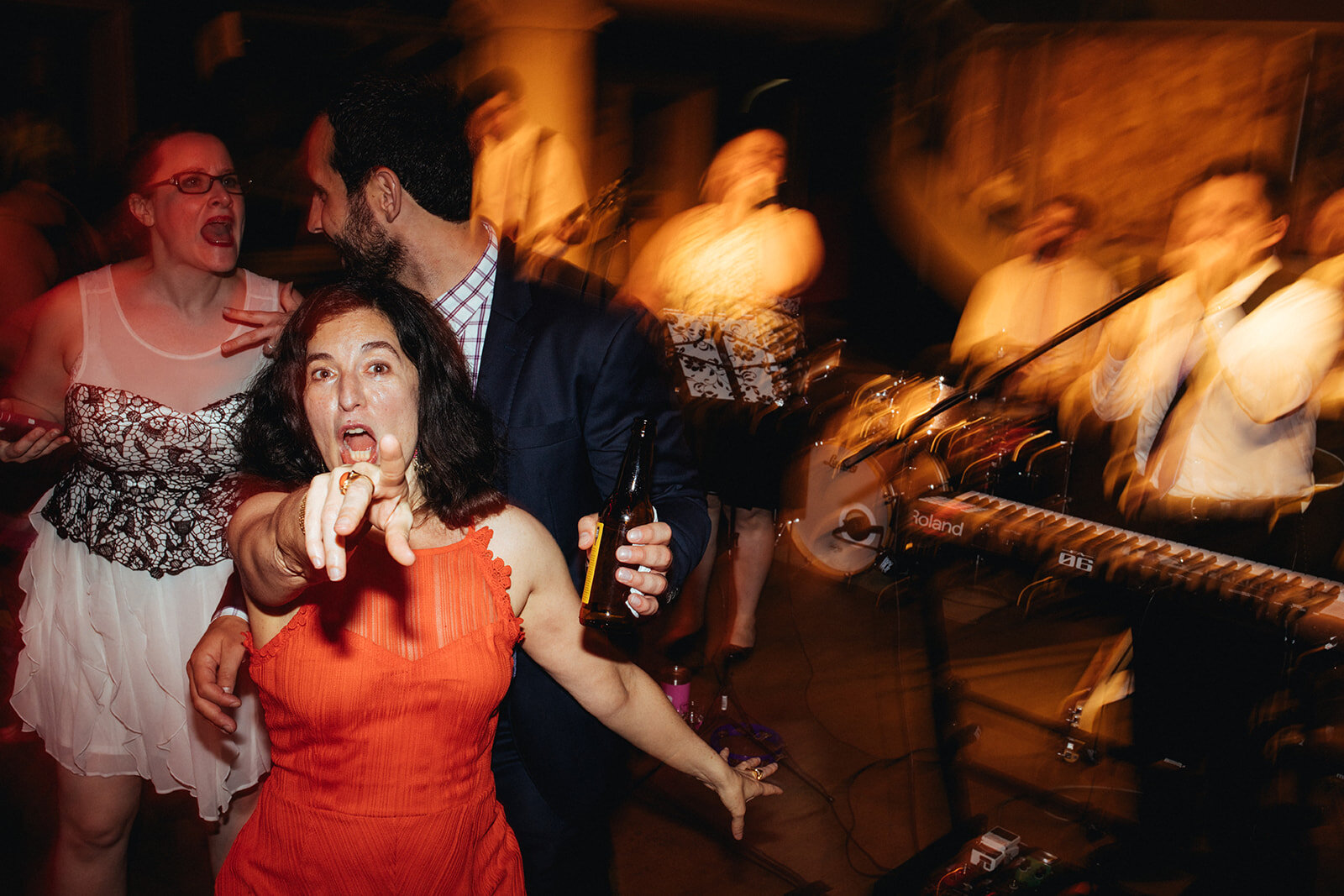 Wedding guests dancing at Torpedo Factory reception Alexandria VA Shawnee Custalow Queer Wedding Photography