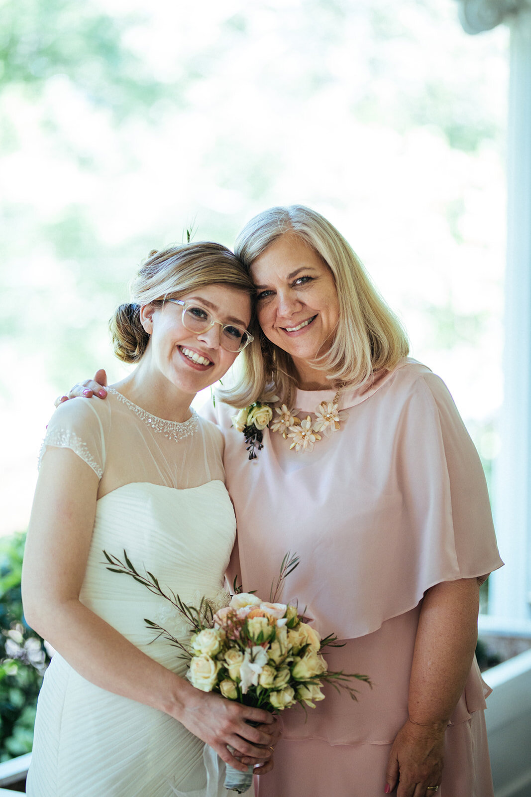 Bride posing with her mother in Atlanta GA Shawnee Custalow Queer Wedding Photographer