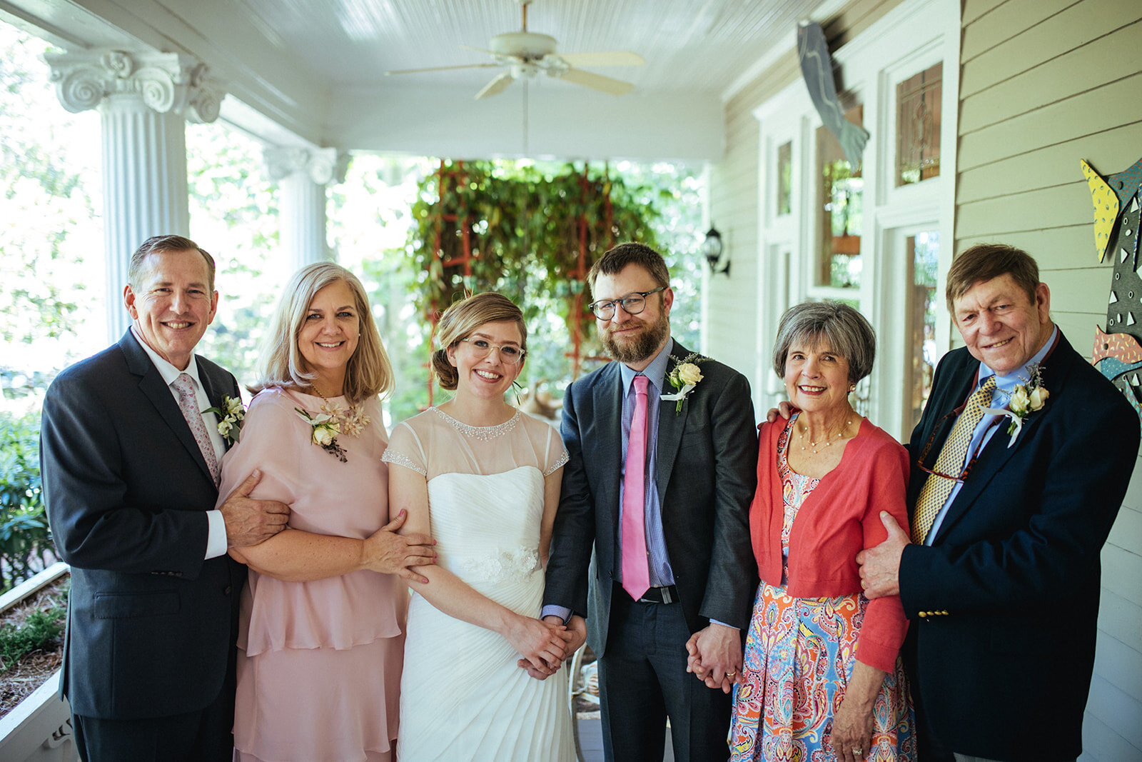 Newlyweds posing with family in Atlanta GA Shawnee Custalow Queer Wedding Photographer
