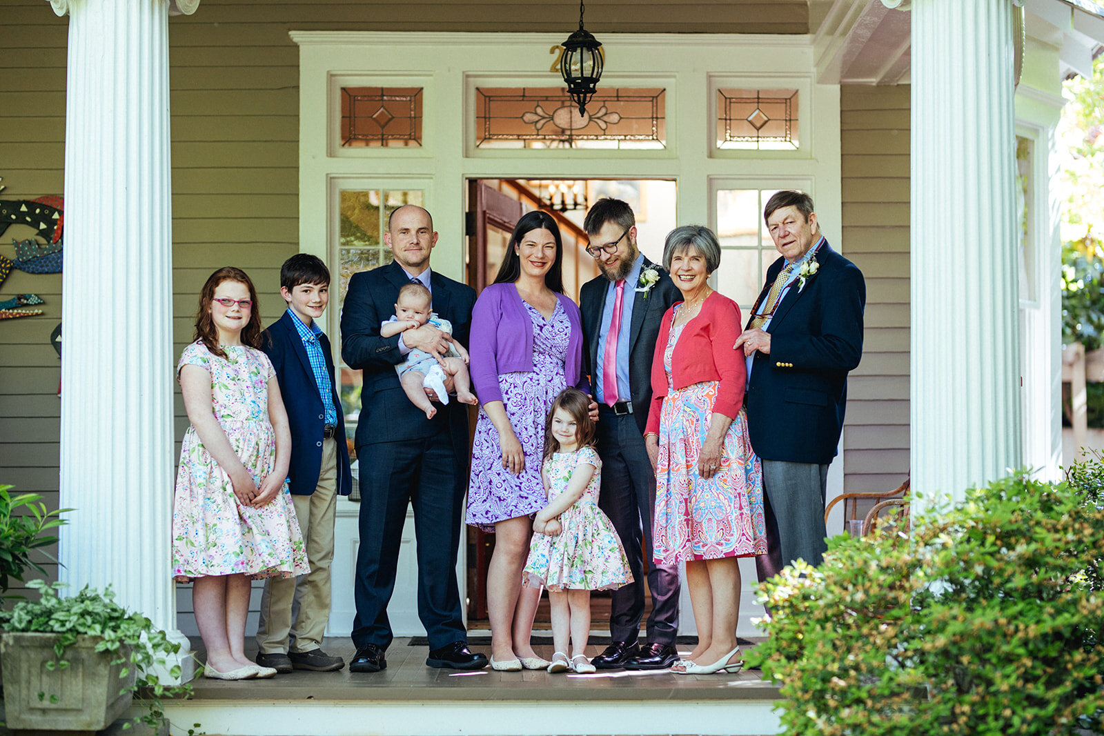 Groom posing with his family at home in Atlanta GA Shawnee Custalow Queer Wedding Photographer