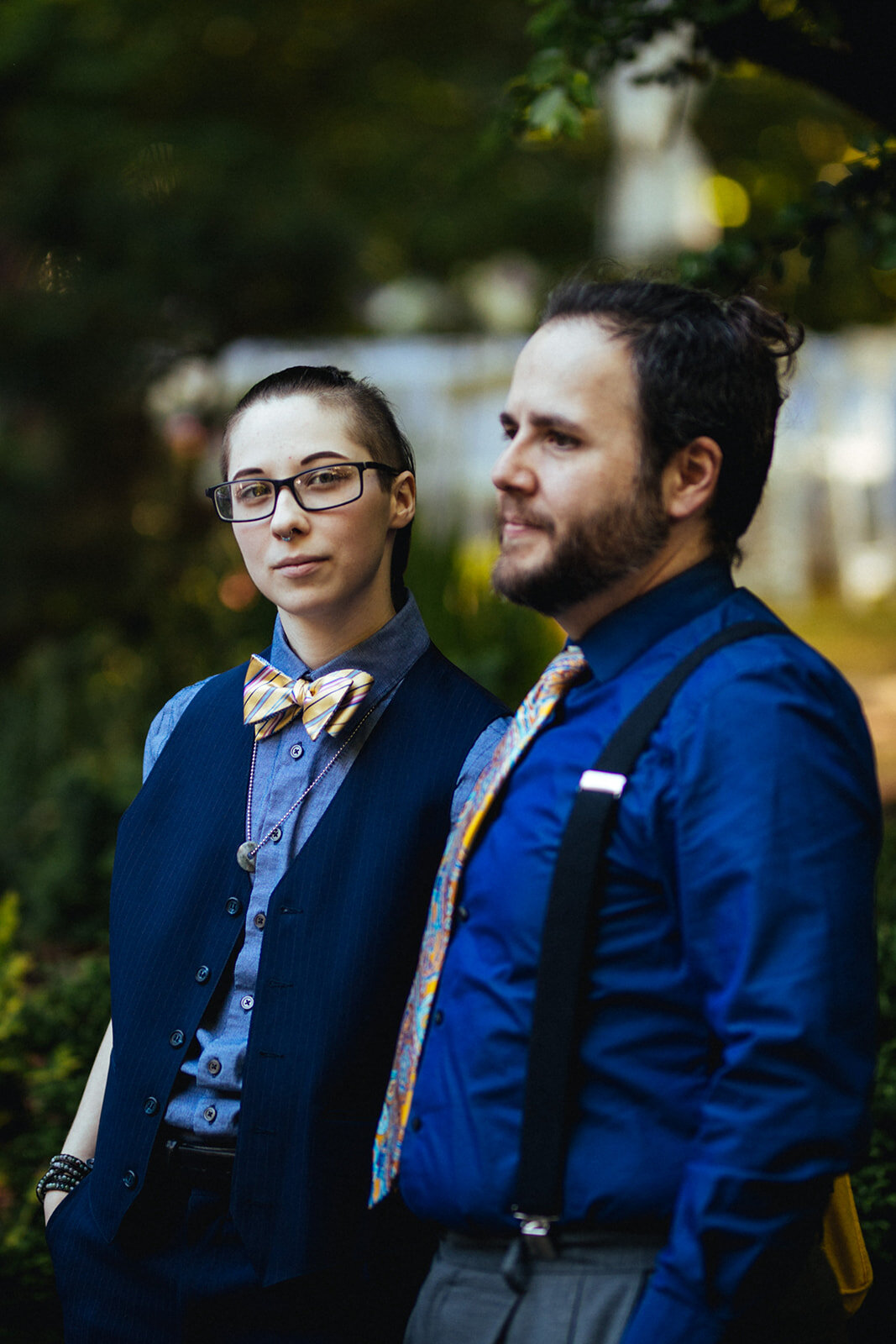 Two guests posing at backyard wedding Atlanta GA Shawnee Custalow Queer Wedding Photographer
