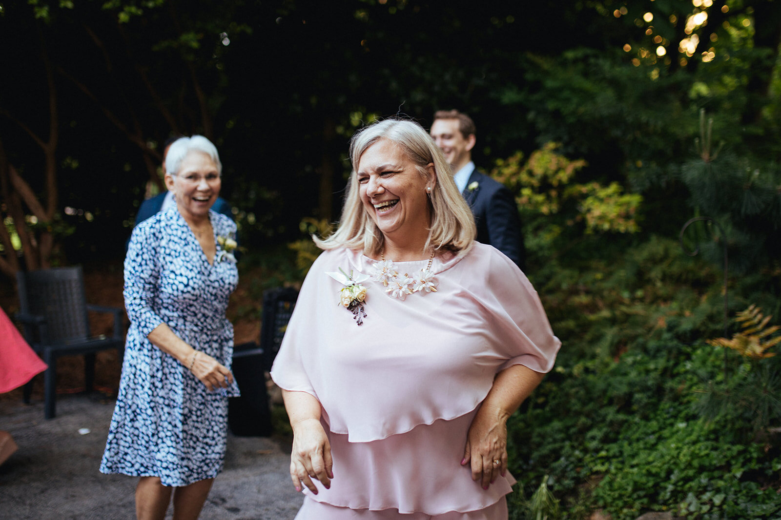 Mother of the bride mingling with guests at backyard reception in Atlanta GA Shawnee Custalow