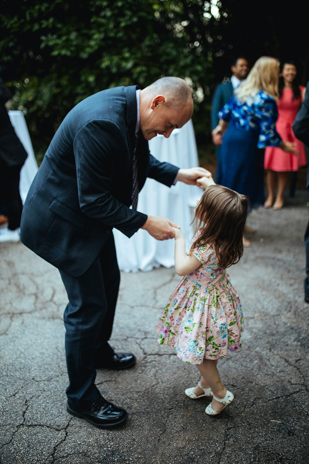 Father dancing with young daughter at backyard reception in Atlanta GA Shawnee Custalow
