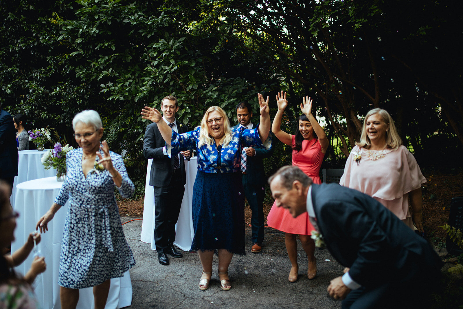 Guests dancing at backyard reception in Atlanta GA Shawnee Custalow Queer Wedding Photographer