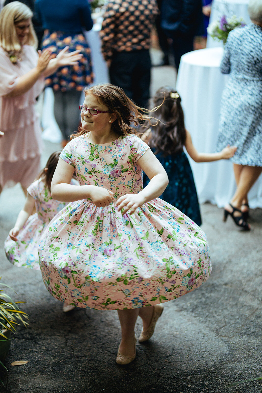 Little girls dancing in matching dresses at Atlanta wedding Guests dancing at backyard reception in Atlanta GA Shawnee Custalow Photographer