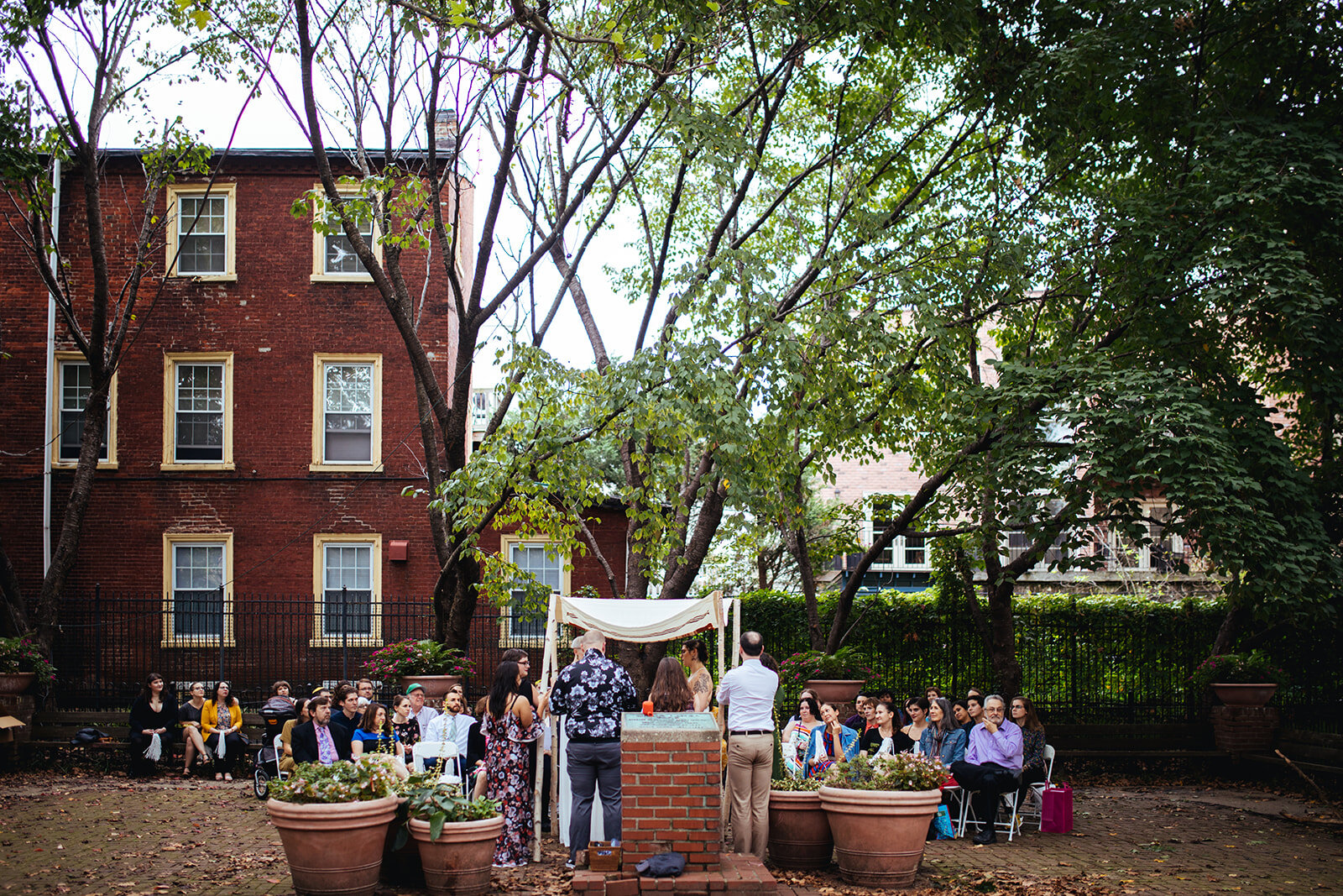 Outdoor wedding under a chuppah in Philadelphia PA Shawnee Custalow Queer Wedding Photography