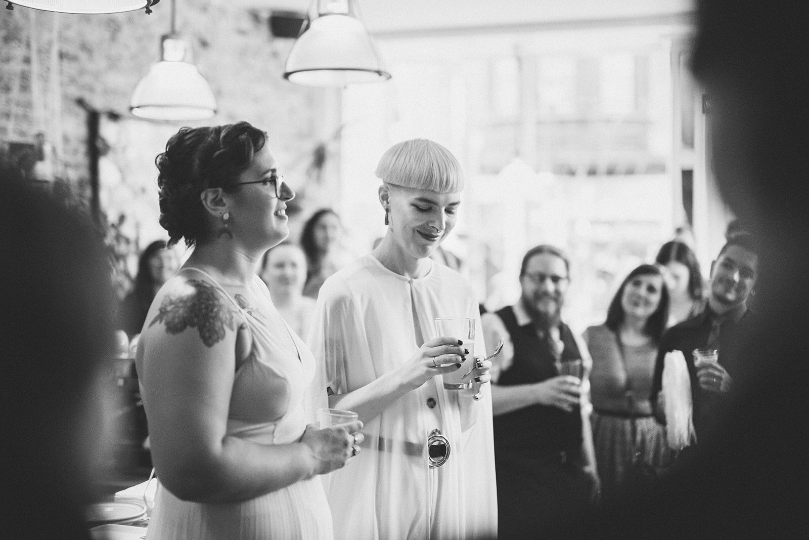 Newlyweds at their wedding reception in Philadelphia Shawnee Custalow Queer Wedding photography