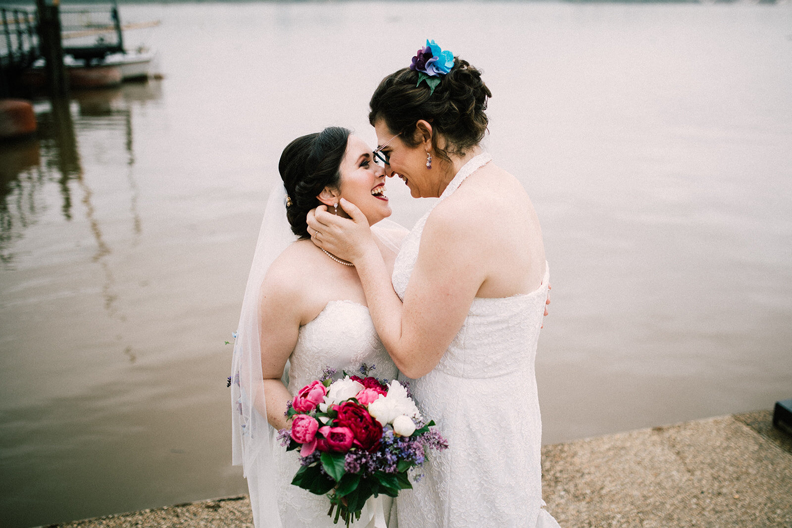 Newlywed brides leaning in for a kiss in Alexandria VA Shawnee Custalow Wedding Photographer