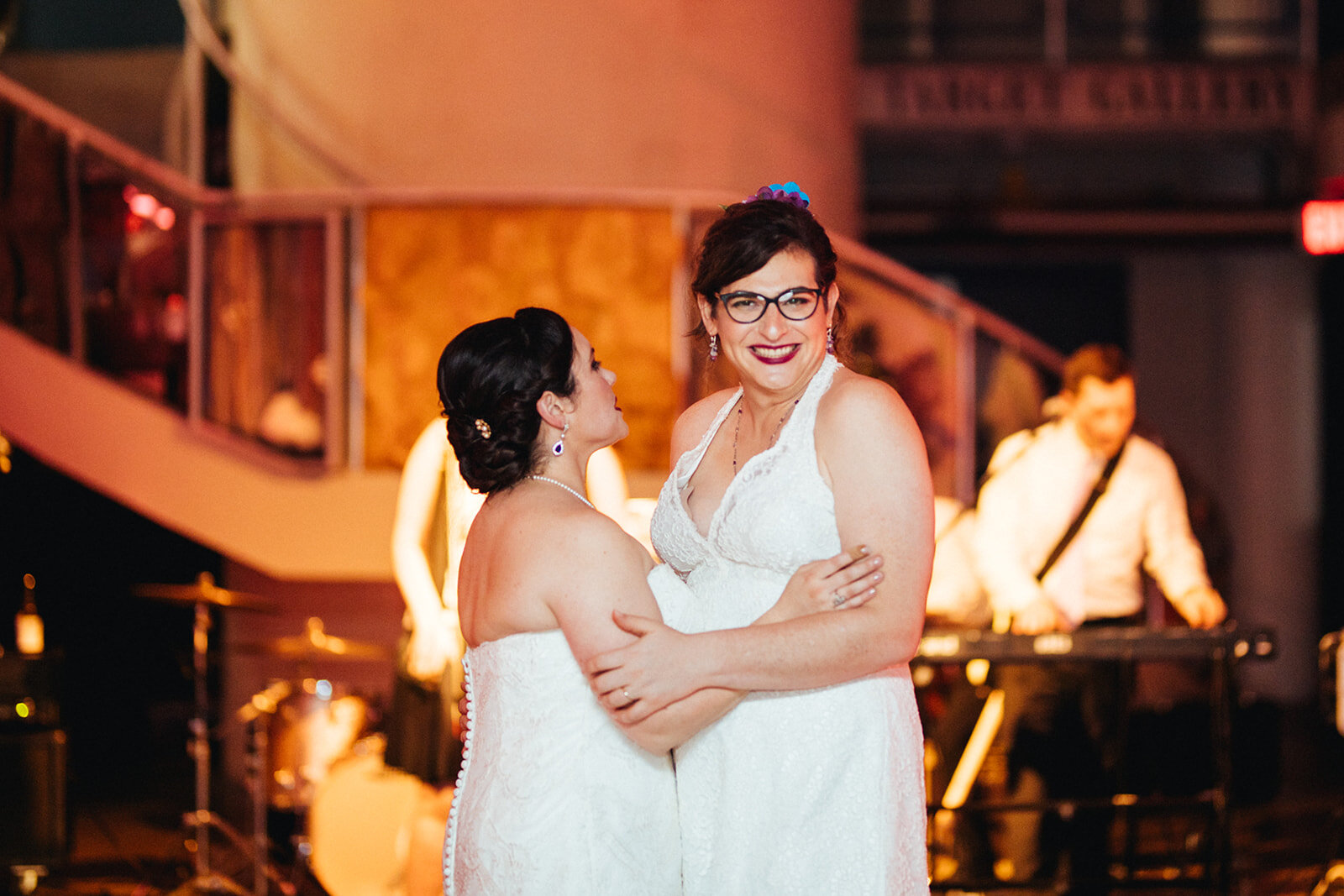 Newly married lgbtq couple dancing at Torpedo Factory Alexandria VA Shawnee Custalow Queer Wedding Photography