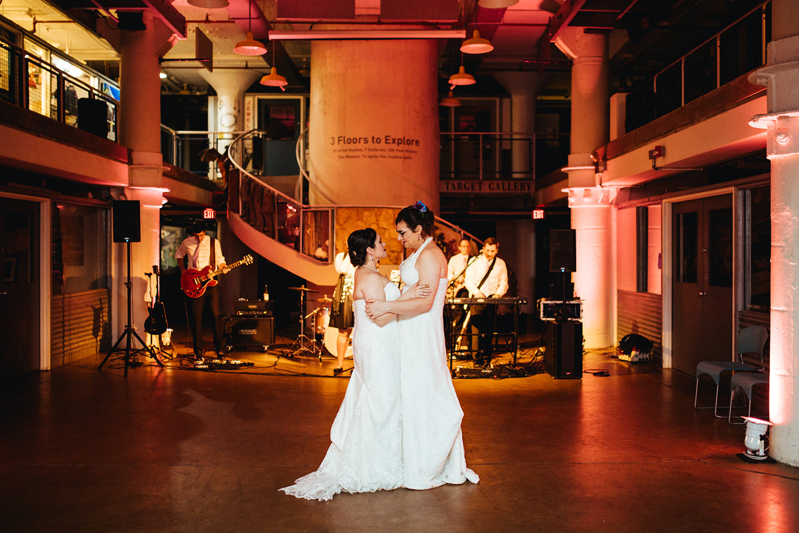 Newlywed have their first dance at Torpedo Factory Alexandria VA Shawnee Custalow Queer Wedding Photography