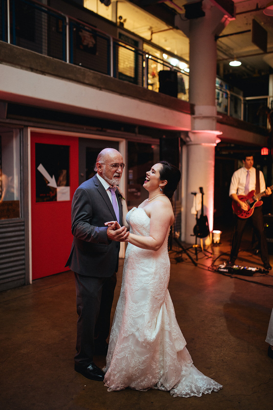 Bride dancing with her father at Torpedo Factory Alexandria VA Shawnee Custalow Queer Wedding Photography