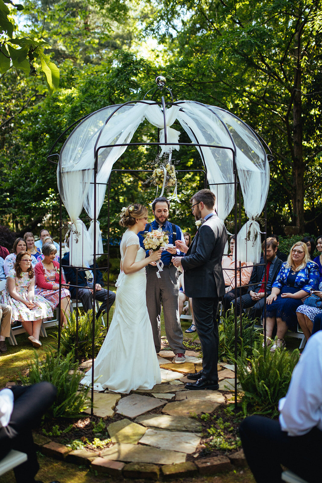 Bride and groom getting married in their backyard in Atlanta GA Shawnee Custalow Queer Wedding Photographer