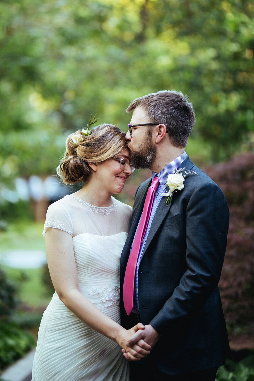 Newly married couple sharing a forehead kiss in Atlanta GA Shawnee Custalow Wedding Photographer