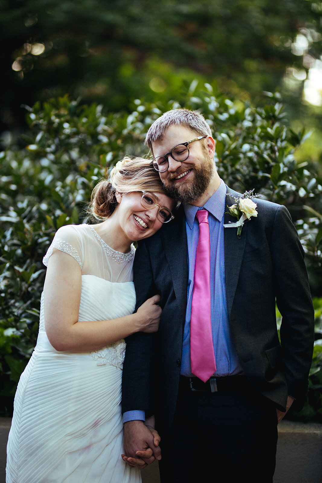 Newlywed leaning on each other in Atlanta GA Shawnee Custalow Queer Wedding Photographer