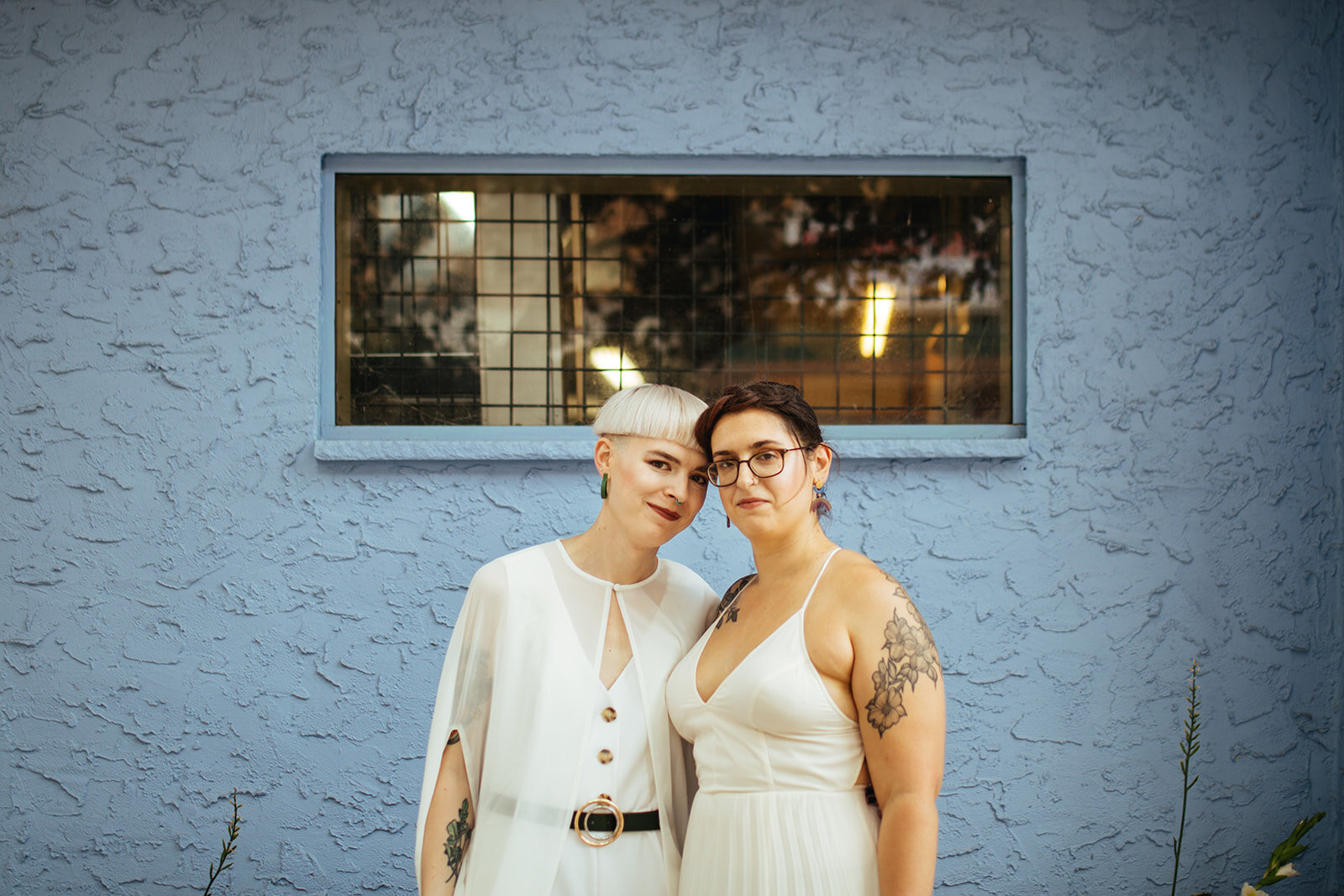 Happy couple posing outside in Philadelphia PA Shawnee Custalow Queer Wedding Photography