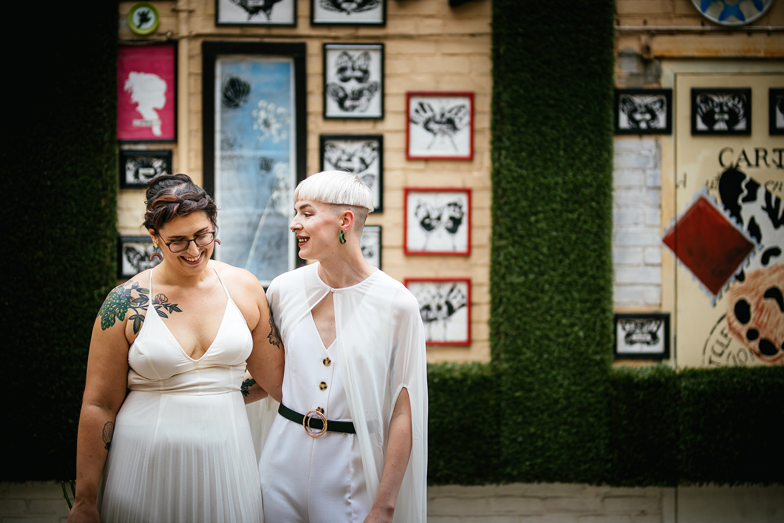 Queer couple embracing by public at in Philadelphia Shawnee Custalow Queer Wedding Photography