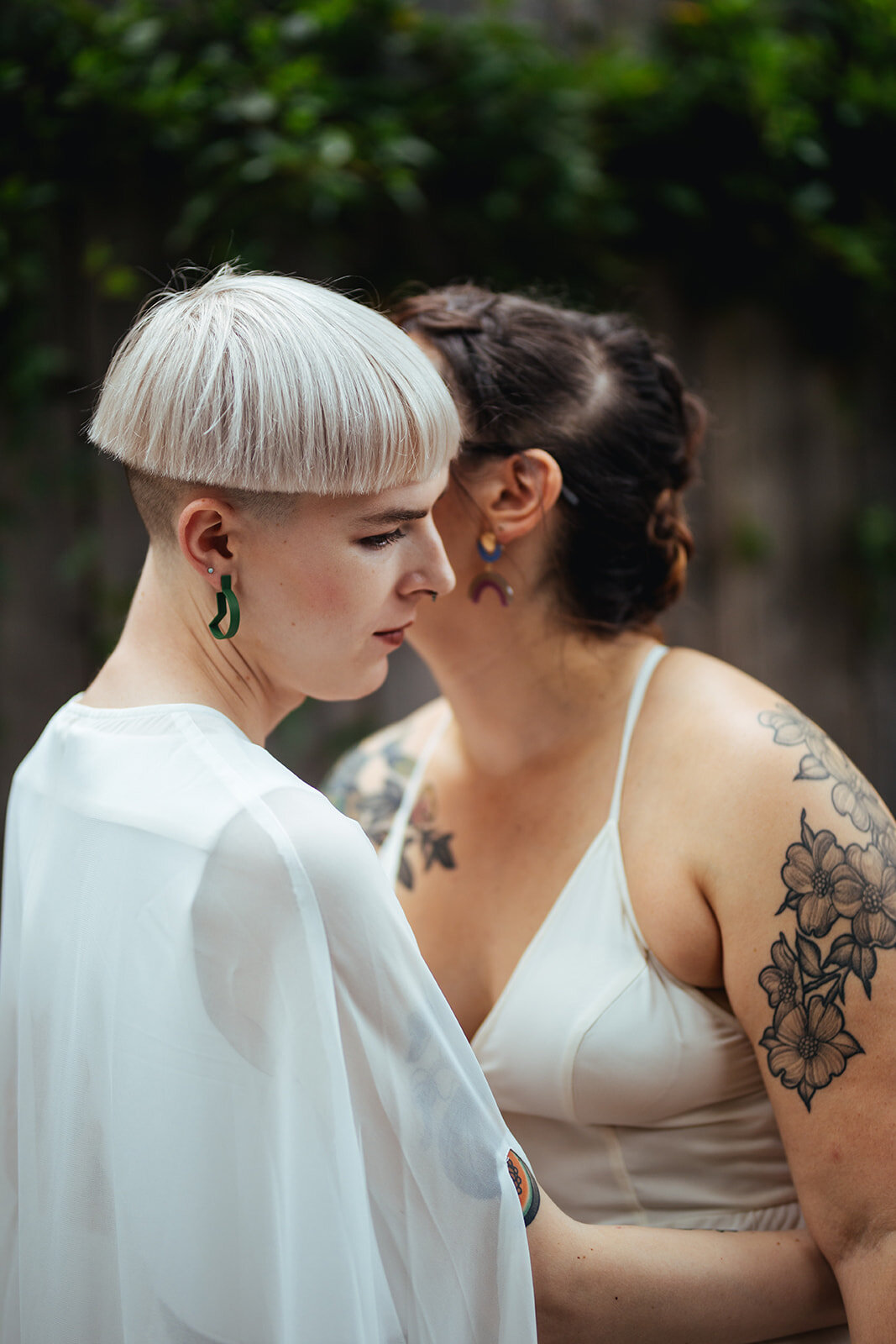 LGBTQ spouses posing seriously in Philadelphia PA Shawnee Custalow Queer Wedding Photography