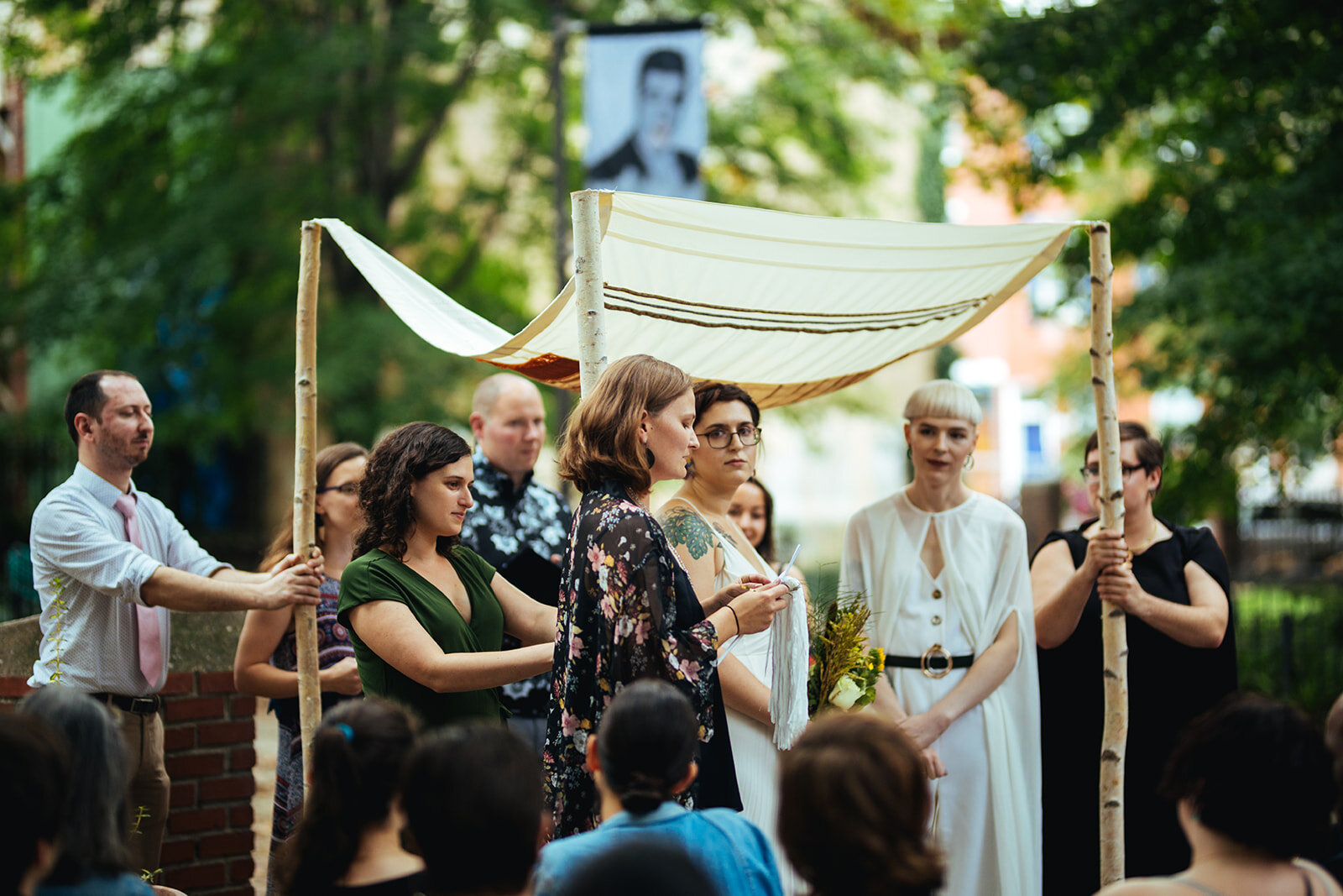 LGBTQ couple getting married under a chuppah in Philadelphia Shawnee Custalow Queer Wedding Photography