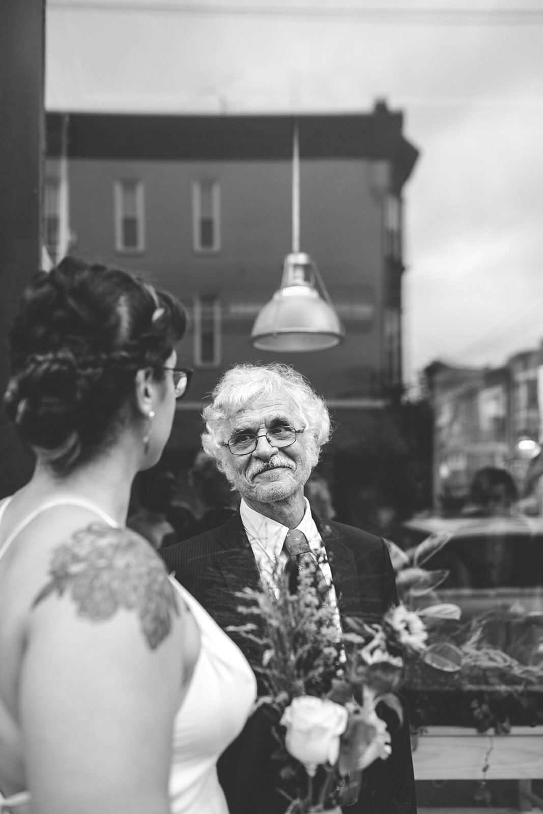 Guest smiling at the bride outside in Philadelphia PA Shawnee Custalow Queer Wedding photography