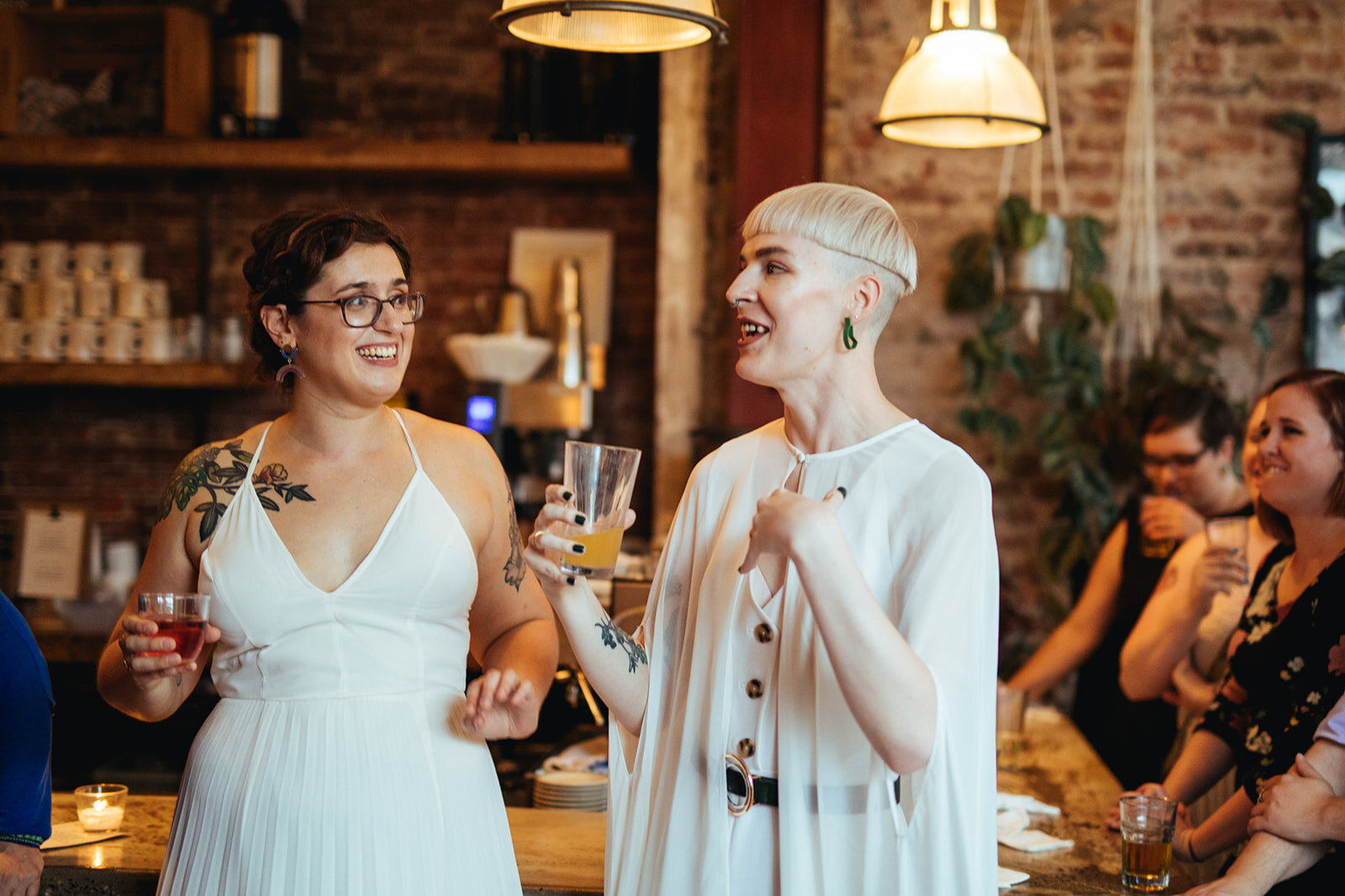 Newlyweds enjoying their wedding reception in Philadelphia Shawnee Custalow Queer Wedding photography