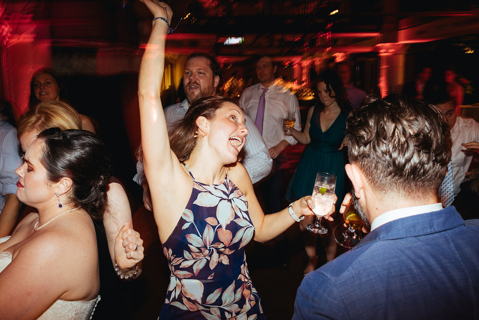 Wedding guests dancing at Torpedo Factory reception Alexandria VA Shawnee Custalow Queer Wedding Photography