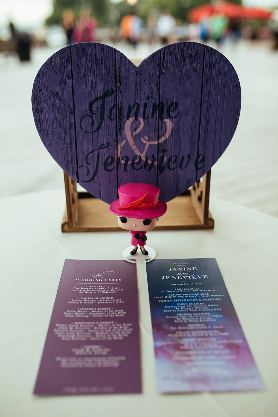 Wooden heart sign with couple's names and wedding stationery in Alexandria VA Shawnee Custalow
