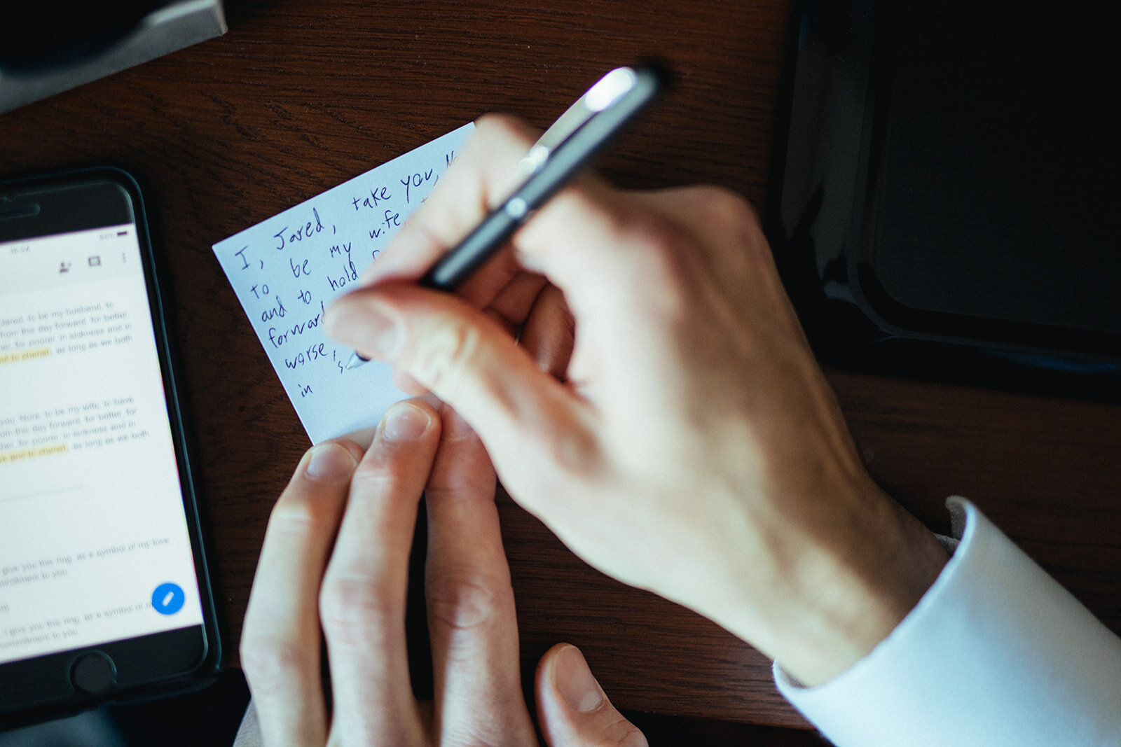 Groom handwriting his vows in Brooklyn New York Shawnee Custalow wedding photography