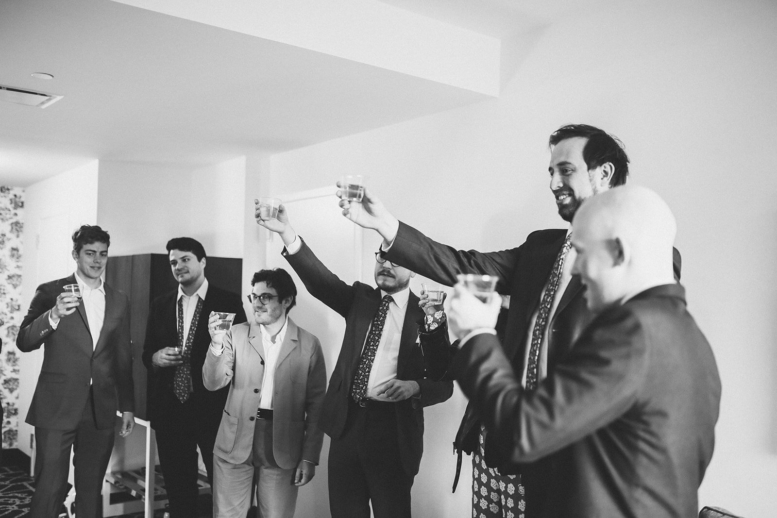 Wedding party raising a toast to the bride and groom in Brooklyn Shawnee Custalow photography