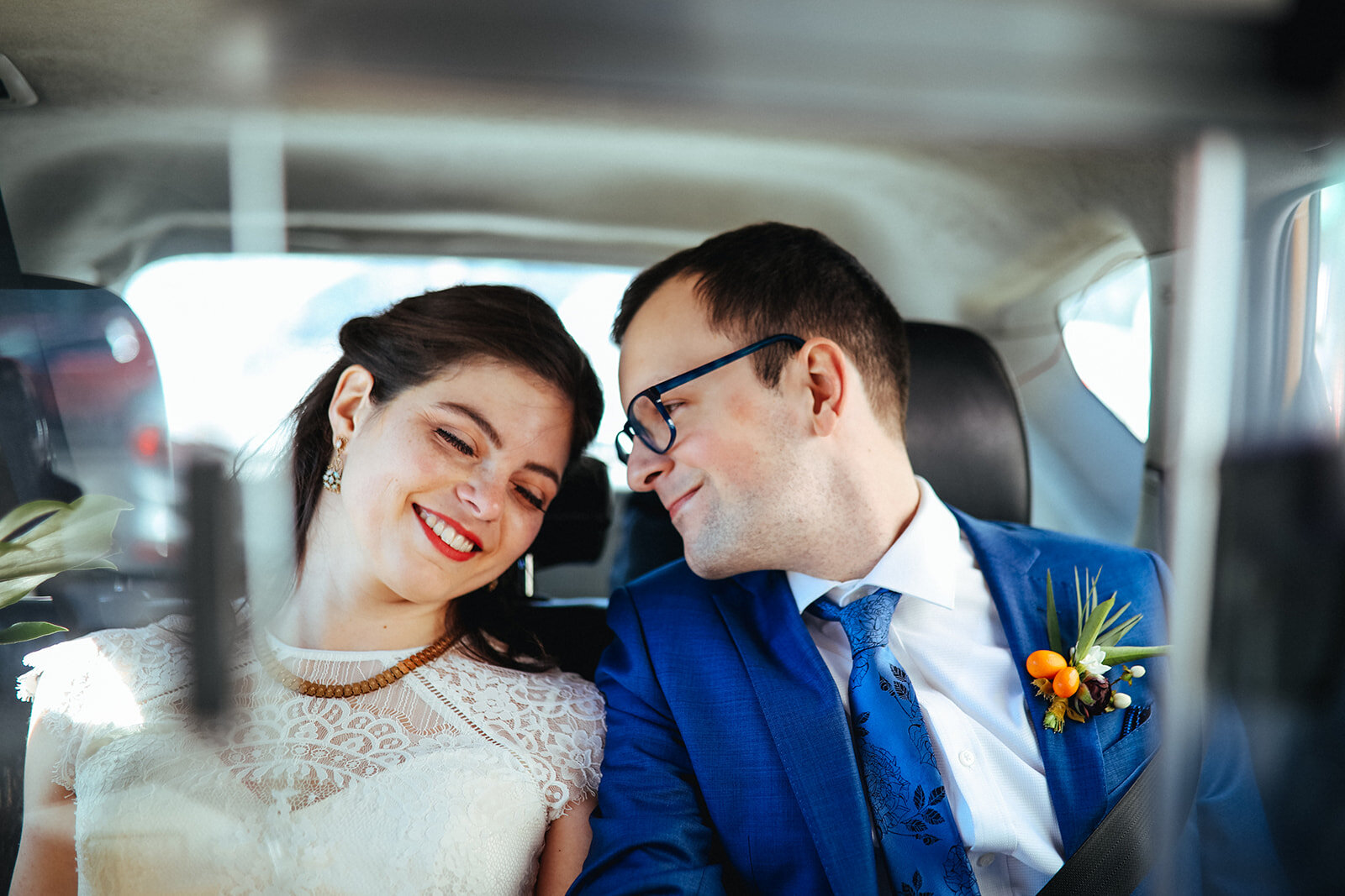 Bride and groom leaning together in a cab in Brooklyn NY Shawnee Custalow wedding photography